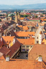 Fototapeta na wymiar Sibiu elevated cityscape with Holy Trinity Cathedral seen from the steeple of the Lutheran Cathedral of Saint Mary