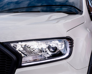 Closeup of a headlight on a modern car