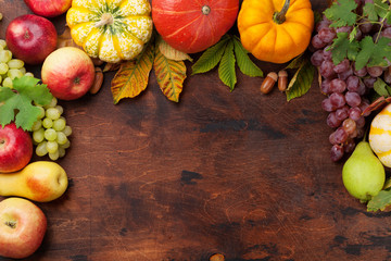 Autumn backdrop with pumpkins and fruits