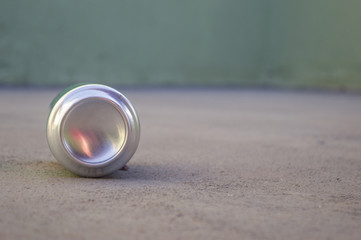 aluminum beverage can of soda on the floor, recycling concept