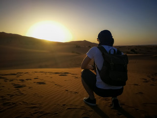 Fototapeta na wymiar Man in the Desert at Sunset