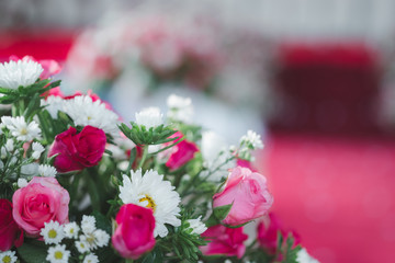 Bouquet of brightly colored roses used for wedding decorations.