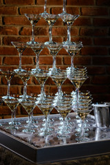 Smoking Champagne Glasses Beautiful Decoration. pyramid of champagne cocktails with smoke at a party