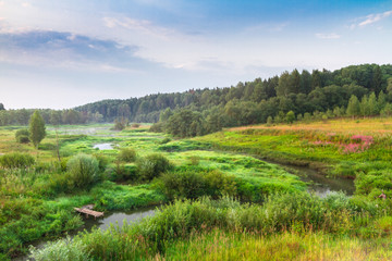 landscape with river and clouds at sunrise