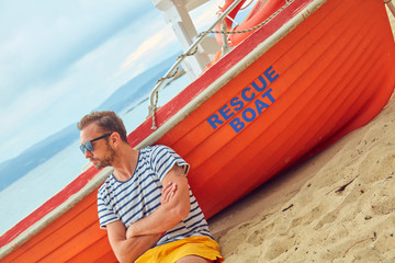 Rescue boat and lifeguard keeping the beach safe in summertime period.