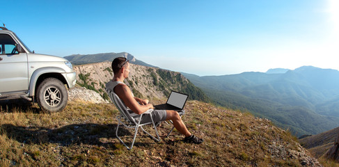 tourist - freelancer on wild nature