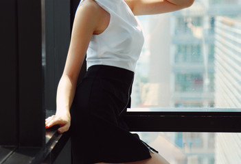 Beautiful Asia Business woman manager smile portrait and office building background in the capital city.