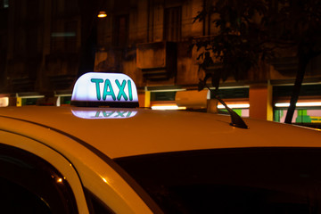 Vehicle Taxi in night on Avenue, central region of Sao Paulo