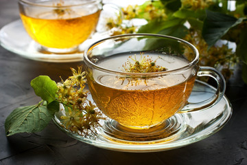 Cup of herbal tea with linden flowers