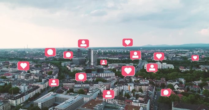 Aerial View of Cityscape with pop up Social Media Like Comment Follower Icons - Powered by Adobe