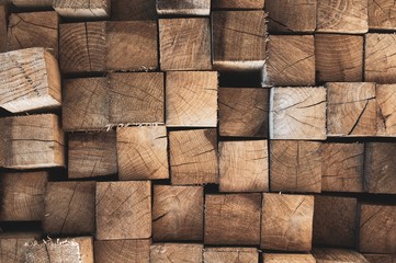 Wooden logs. Firewood wall. Wooden background.