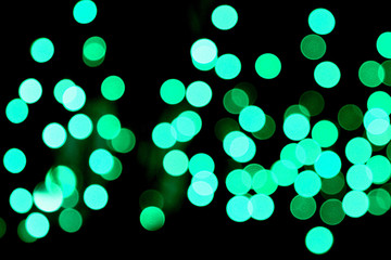 Unfocused abstract colourful bokeh black background. defocused and blurred many round blue light