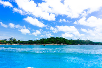 Obraz na płótnie Canvas Island in the blue sea and blue sky and clouds