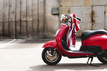 red scooter with American flag on handle