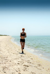 Fototapeta na wymiar girl running seaside