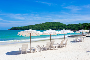 The blue sea with blue sky and clouds ,tropical beach background as summer landscape with beach chairs and beautiful sea view