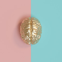 3d rednering image of a gold human brain, blue and pink background