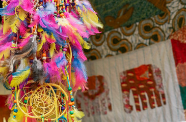 Amulet Dream Catcher of multicolored feathers. Native American dream catcher amulet that protects a sleeping person from evil spirits.