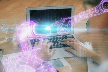 AR hologram with man working on computer on background. Augmented reality concept. Double exposure.