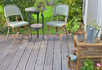 chairs and other garden furniture on a wooden terrace
