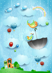 Surreal landscape with village, flying umbrella and fishes