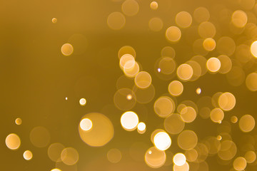 abstract gold background with soft blur bokeh light effect, background bokeh