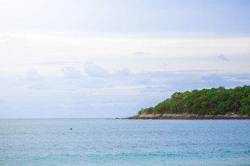Island in the blue sea and blue sky and clouds