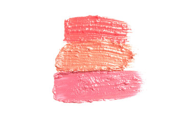 Lipstick smears isolated on white background. Makeup products