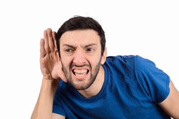 Young man trying to listen something.