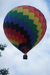 Fototapeta premium Colorful Hot Air Balloon in Cloudy Sky