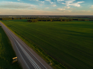 Top view of the road in summer evening. View from drone