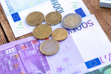 Pack of euro banknotes and coins background finance economy currency close up selective focus Europe currency