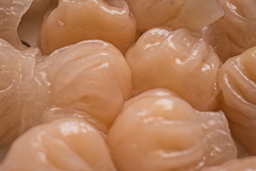 Dough pockets formed from a dough with starch flour and steamed in steam, filled with spiced...