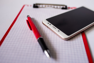 notebook and pen on white background