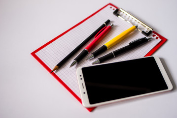 notebook and pen isolated on white background