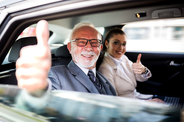 A successful pair of businessmen celebrates a business deal