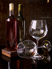 glass of red wine and bottle of wine