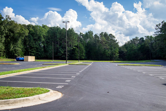 Empty parking lot on sunny day