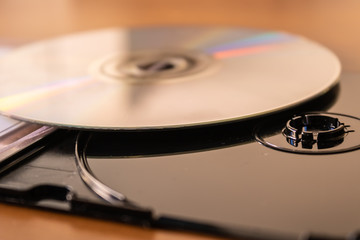 Black plastic CD DVD disc box with CD disc closeup - Image