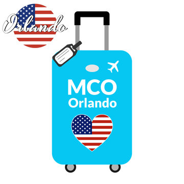 Luggage with airport station code IATA or location identifier and destination city name Orlando, MCO. Travel to the United States of America concept. Heart shaped flag of the USA on the baggage.