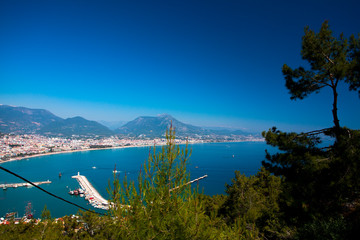 Beautiful view of the Mediterranean Sea, mountains, forest, city, marina and lighthouse.Turkey, Alanya.