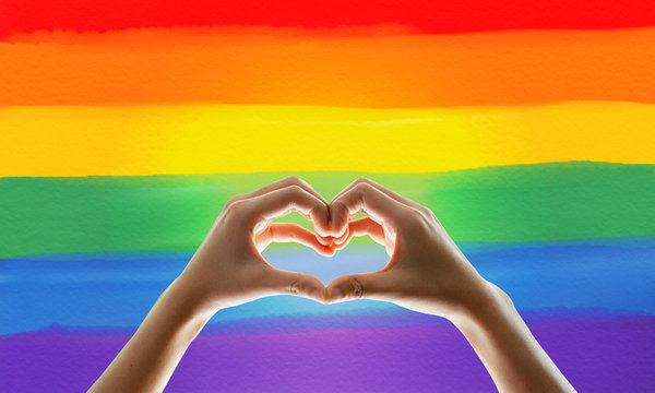 Rainbow flag, hand showing heart symbol