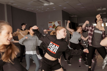 Dancers practicing hip-hop dance in studio