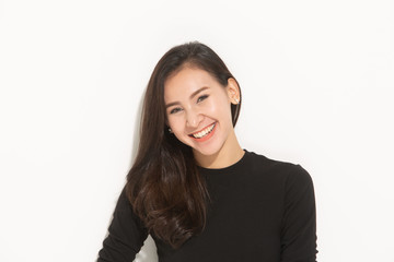 Obraz premium close-up portrait young pretty woman smiling in black t-shirt on white background, happy, positive mood, isolated