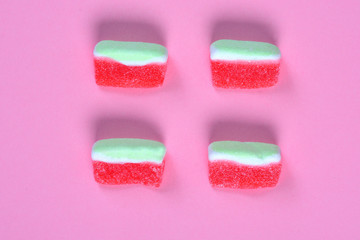 group of watermelon candy on pink background