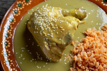 Mexican chicken with green mole sauce and red rice