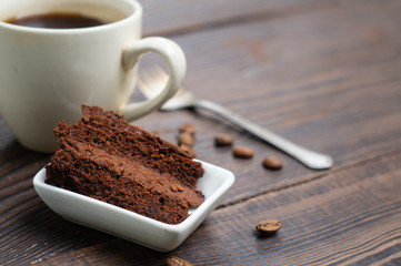 A slice of chocolate cake and a cup of coffee