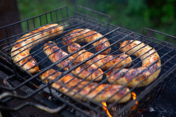 Creative concept food photo of bbq barbequue grill sausages on fire.