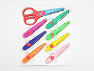 Colorful Scissor Design with Various Paper Pattern Cutting for Children Education in White Isolated Background