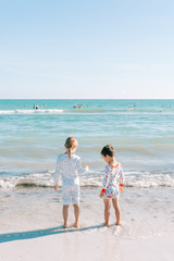 Brother and Sister Walking on Beach